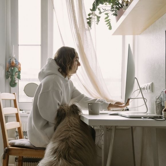 woman working from home with her dog